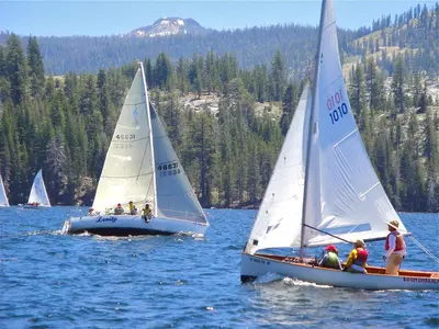 a group of sailboats in a body of water at New England Cottage in Shaver Lake