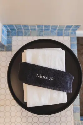 a black plate with two towels on a table at Historic Sonora Inn in Sonora