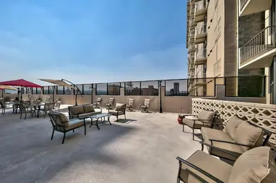 a patio with chairs and tables on a balcony at Plaza Resort Club Reno in Reno