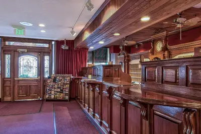 a large room with a bar in a library at Plaza Resort Club Reno in Reno