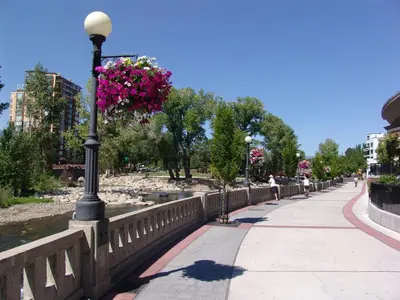 a street light with pink flowers on a fence at Plaza Resort Club Reno in Reno