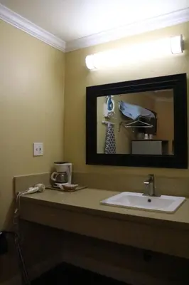 a bathroom with a sink and a mirror at Timberline Motel in Lone Pine