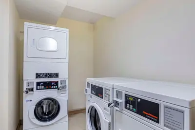 a laundry room with a washer and dryer at Comfort Inn & Suites Rocklin - Roseville in Rocklin