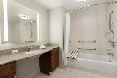 a bathroom with a sink and a tub and a shower at Homewood Suites by Hilton Sacramento/Roseville in Roseville