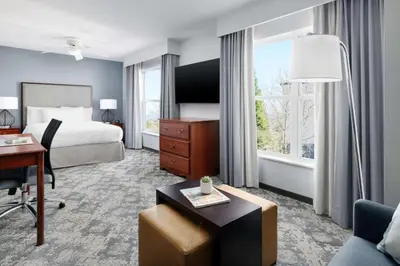 a hotel room with a bed and a desk at Homewood Suites by Hilton Sacramento/Roseville in Roseville
