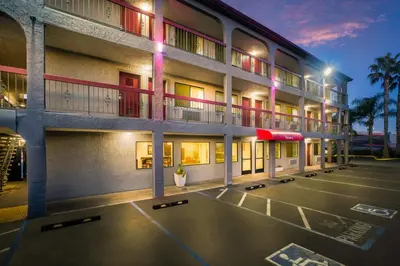 a building with a basketball court in a parking lot at Red Roof Inn Stockton in Stockton