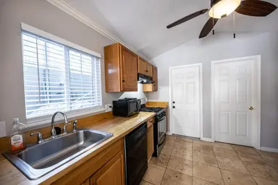 a kitchen with a sink and a stove at Emerald Bay Lodge in South Lake Tahoe