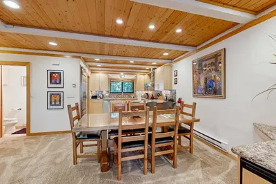 a dining room with a table and chairs at Brockway Springs #36 in Kings Beach