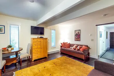 a living room with a couch and a table at Casa del Lago in Tyrolian Village