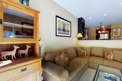 a living room with a couch and a table at McCloud 137 in Incline Village