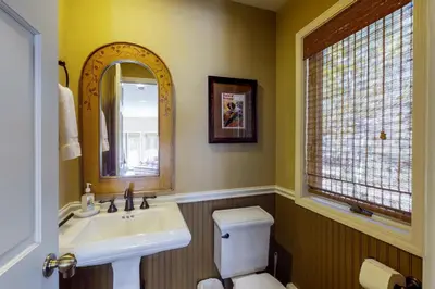 a bathroom with a sink and a toilet and a mirror at McCloud 137 in Incline Village