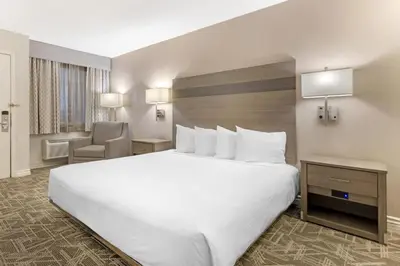 a large white bed in a hotel room at Best Western Kettleman City Inn & Suites in Kettleman City