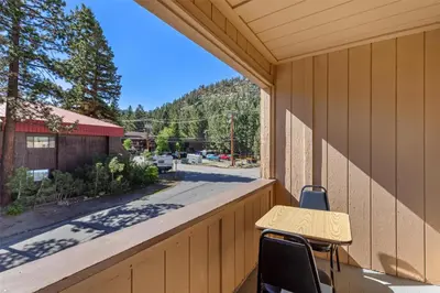 a desk on the porch of a house at SureStay Plus Hotel by Best Western Mammoth Lakes in Mammoth Lakes