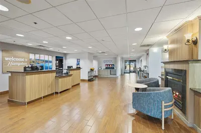a lobby of a hospital with a waiting room at Hampton Inn & Suites Madera in Madera