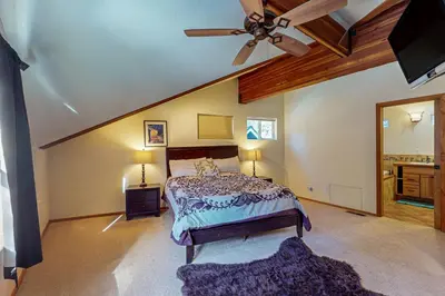 a bedroom with a bed and a ceiling fan at Everness Dawn Retreat* in Mevers