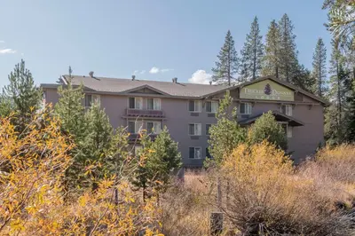 a view of the lodge from the trees at Truckee Donner Lodge in Truckee