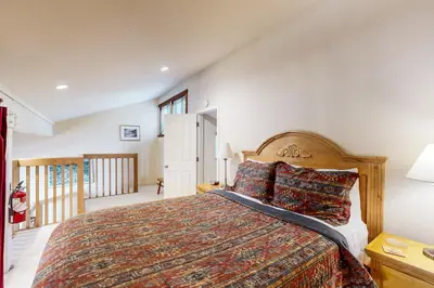 a bedroom with a large bed in a room at Donner Lake Retreat in Donner Pines Tract