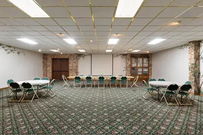 a conference room with tables and chairs in it at Red Lion Inn & Suites Lemoore in Lemoore