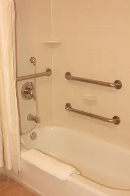 a bathroom with a bath tub with a shower at Hilton Garden Inn Clovis in Clovis