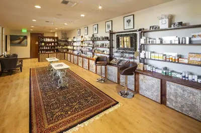 a store with a rug and chairs in a room at The Murieta Inn and Spa in Rancho Murieta