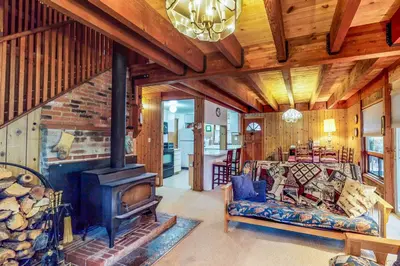 a living room with a fireplace and a couch at Picture Perfect Chalet in Prosser Lakeview Estates