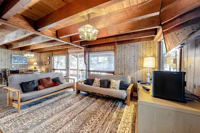 a living room with two couches and a tv at Picture Perfect Chalet in Prosser Lakeview Estates
