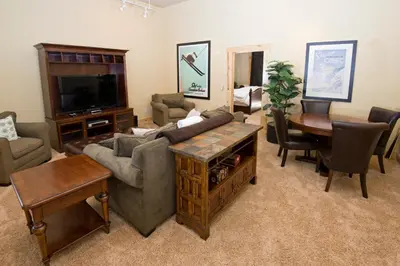 a living room with a couch and a table at Kirkwood Mountain Resort by Vail Resorts in Kirkwood