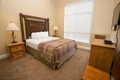 a bedroom with a large bed and a window at Kirkwood Mountain Resort by Vail Resorts in Kirkwood