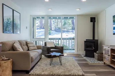 a living room with a couch and a fireplace at Crestview 35 in Mammoth Lakes