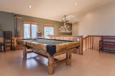 a large room with a pool table in it at Snowcreek V 820 in Mammoth Lakes
