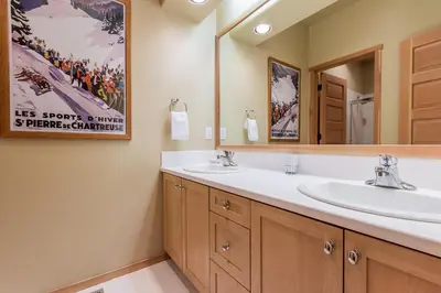 a bathroom with two sinks and a mirror at Snowcreek V 820 in Mammoth Lakes