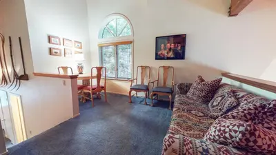 a living room with a couch and a table at Bridges Townhome #09 Condo in Mammoth Lakes