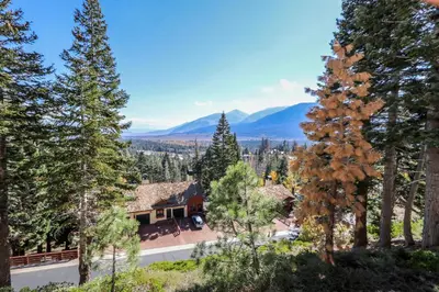 an aerial view of a house surrounded by trees at Bridges #105 Condo in Mammoth Lakes