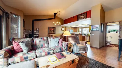 a living room with a couch and a table at Forest Creek #28 Condo in Mammoth Lakes