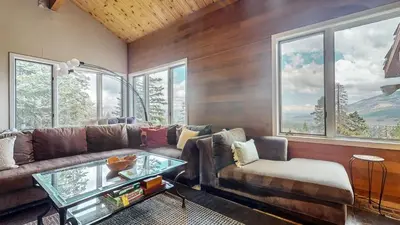 a living room with a couch and a glass table at Bridges Townhome #13 Condo in Mammoth Lakes