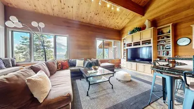 a living room with a couch and a tv at Bridges Townhome #13 Condo in Mammoth Lakes