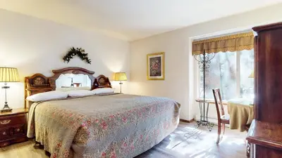 a bedroom with a large bed and a window at Horizons 4 #188 Condo in Mammoth Lakes