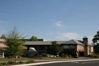 a building with a clock tower on top of it at Days Inn by Wyndham Rocklin/Sacramento in Rocklin