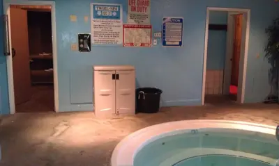 a bathroom with a tub in the middle of a room at Alpenhof Lodge in Mammoth Lakes