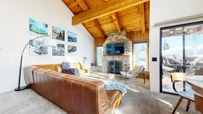 a living room with a couch and a fireplace at Val D'Isere #35 Condo in Mammoth Lakes