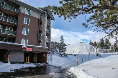 a building and a glass dome in the snow at Juniper Springs Lodge #539 Condo in Mammoth Lakes
