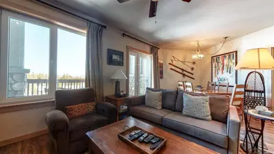 a living room with a couch and a table at Juniper Springs Lodge #539 Condo in Mammoth Lakes