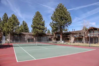 a tennis court in front of a building at Condo de los Pinos #16 in Mammoth Lakes