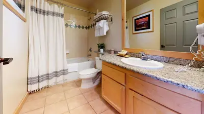 a bathroom with a sink and a toilet and a shower at Sunstone #214 Condo in Mammoth Lakes