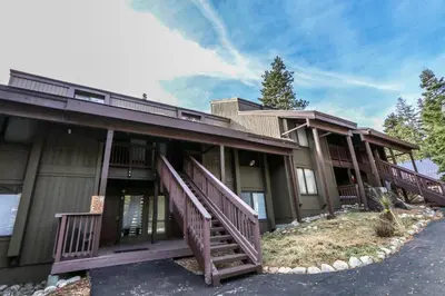 a large house with wooden decks on the side of it at Val D'Isere #6 Condo in Mammoth Lakes