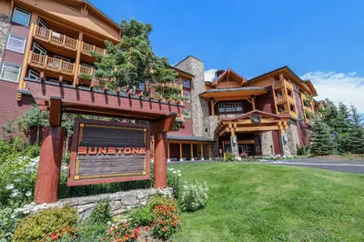 a large building with a sign in front of it at Sunstone #127 Condo in Mammoth Lakes