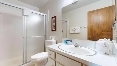 a bathroom with a sink and a toilet and a shower at Chateau Blanc #25 Condo in Mammoth Lakes