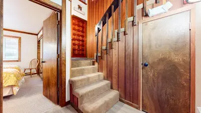 a hallway with stairs leading to a room with a door at Mammoth West #111 Condo in Mammoth Lakes