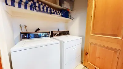 a washer and dryer in a small laundry room at Bridges Townhome #15 Condo in Mammoth Lakes