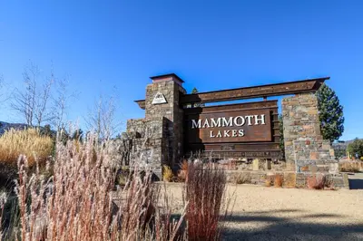 a sign for the mannum takes sign in a field at Mammoth West #115 Condo in Mammoth Lakes